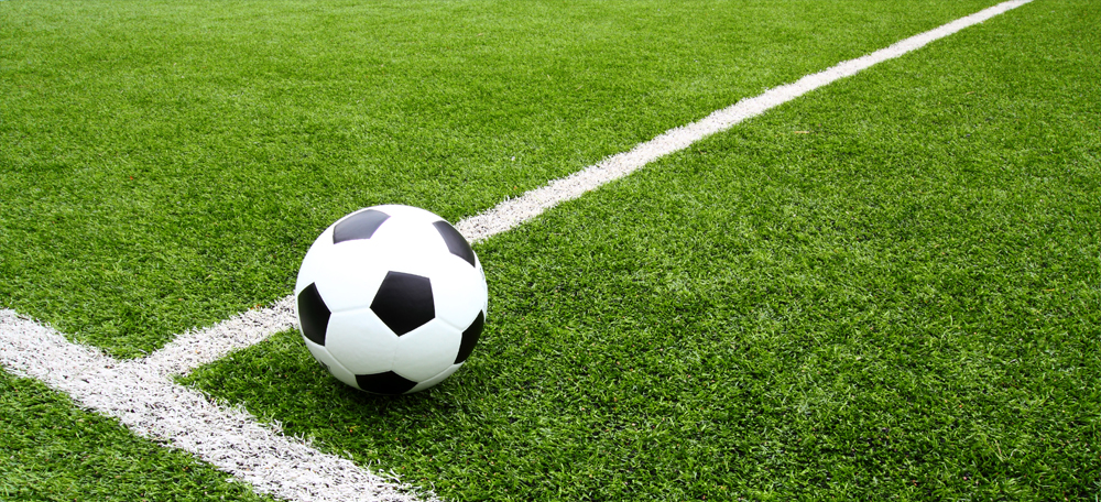 Image of a football pitch and a football.