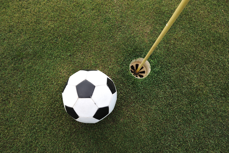 Image of a football on a golf course.
