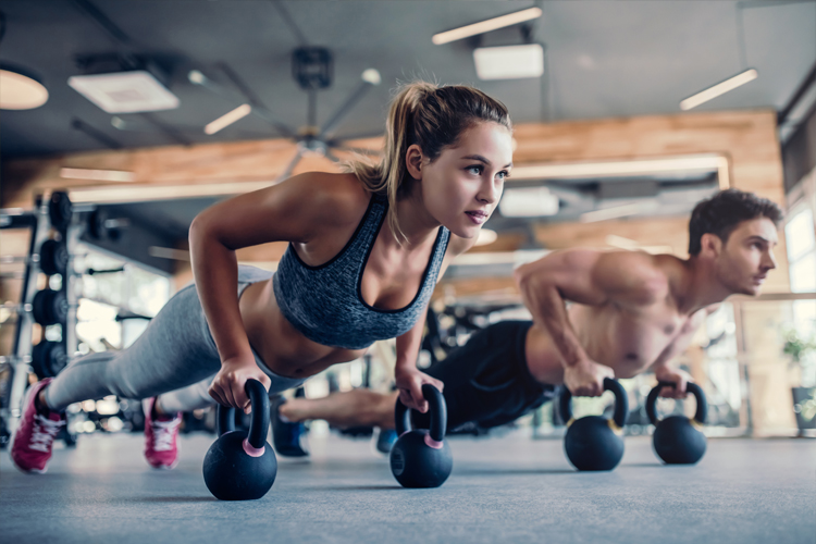 Image of a man and woman doing press ups.