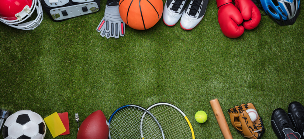 Various Sport Equipment's On Green Grass